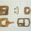 belt buckles recovered from salvage excavation at GH14